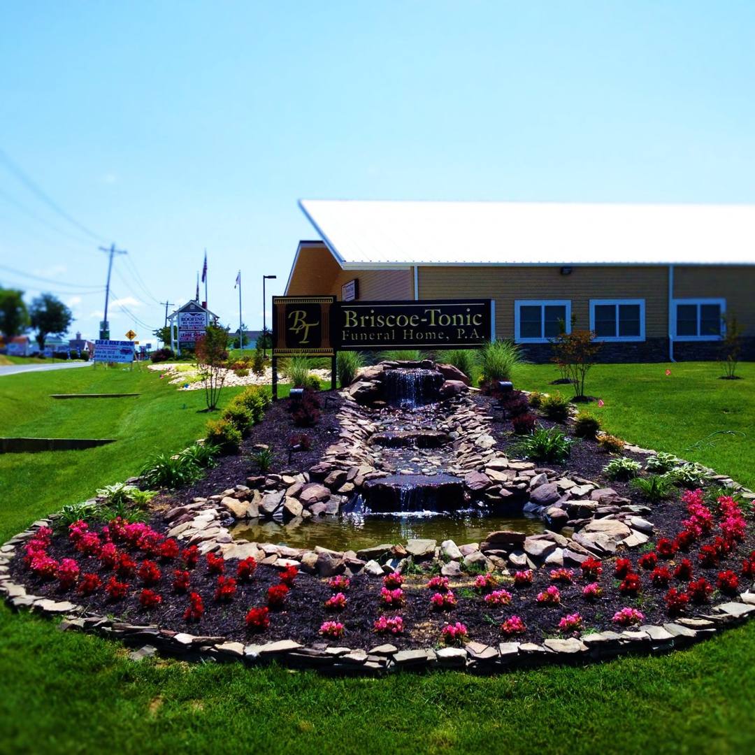 Landscaped stone water feature and flower bed at Briscoe-Tonic Funeral Home