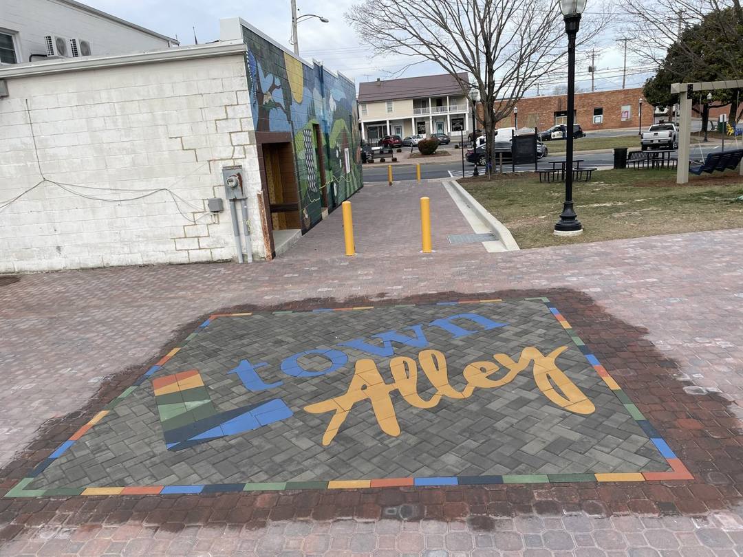 Leonardtown Alley logo paver inlay in a downtown walkway