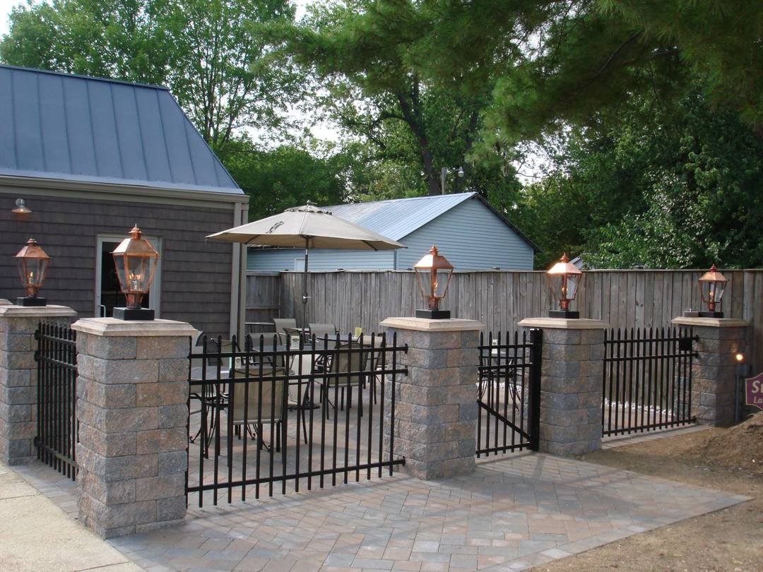 Stone pillars and lantern posts around the Old Towne Pub patio