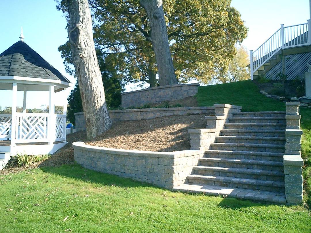Paver steps and retaining wall climbing to a gazebo