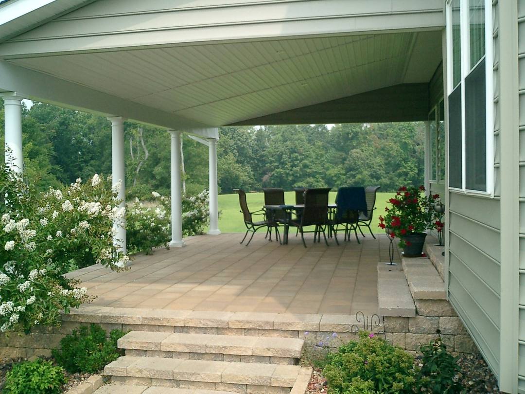 Paver steps up to a covered porch